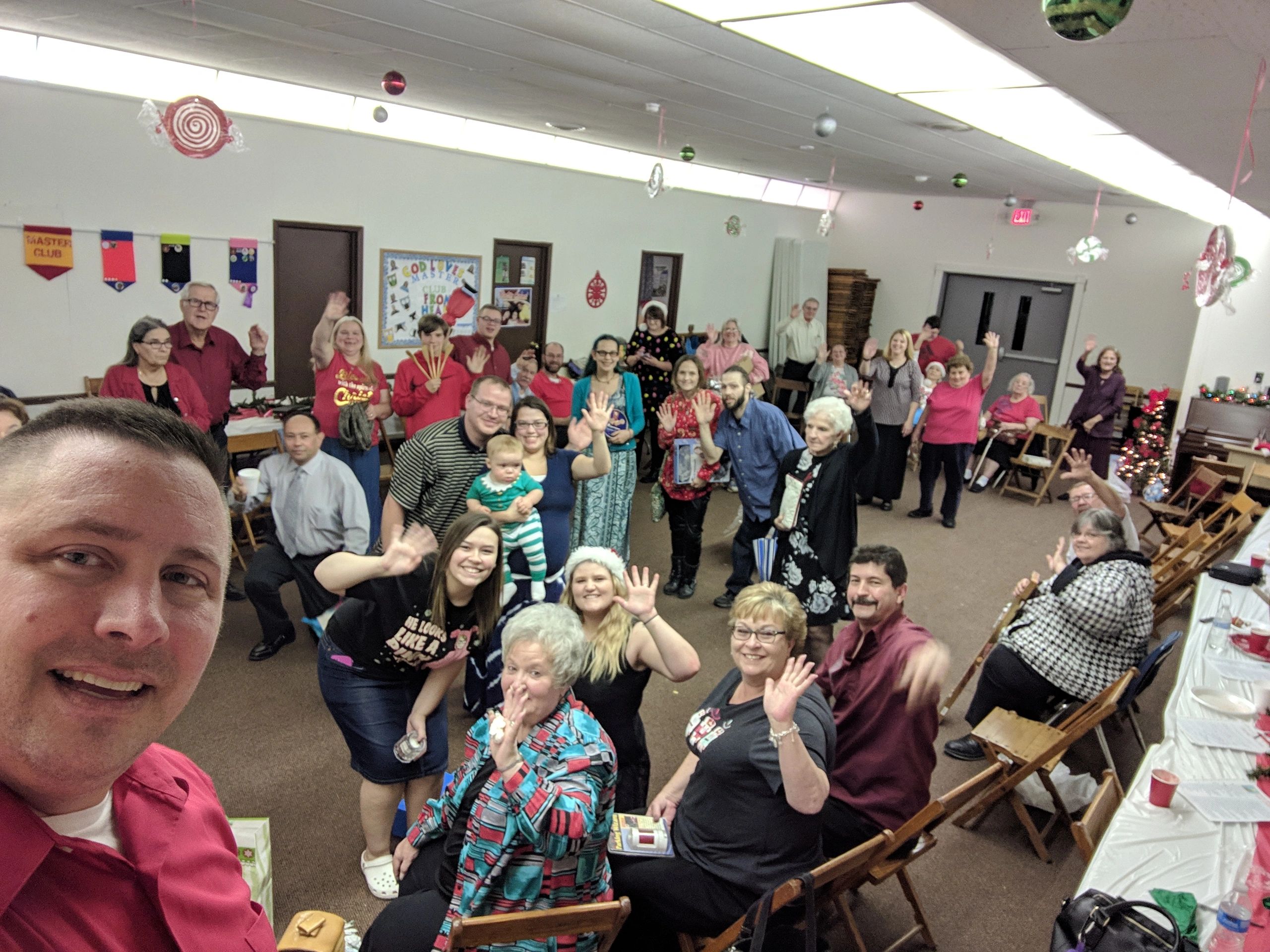 Bible Baptist Temple church family gathered together and waving hello